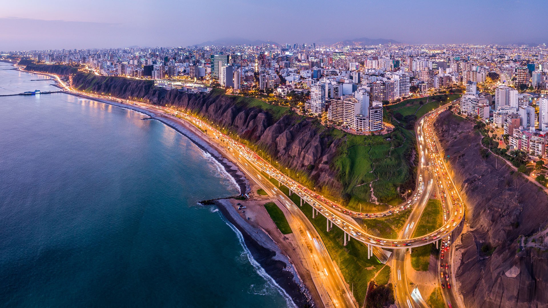 Lima Peru coastline and city skyline at dusk